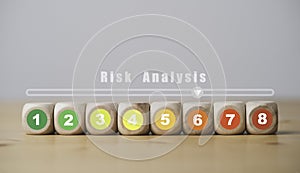 Risk rating from low to high number print on wooden cube block for risk assessment analysis and management concept