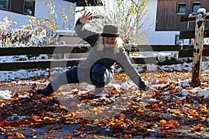 Risk of slipping in autumn and winter. A woman slipped on wet, smooth leaves