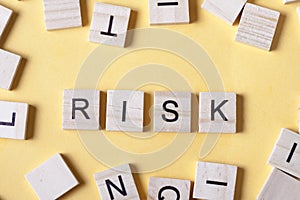 Risk word at wooden blocks on table. Top view