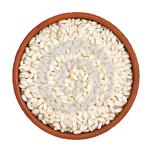 Risotto rice in a bowl Isolated on a white background. View from above