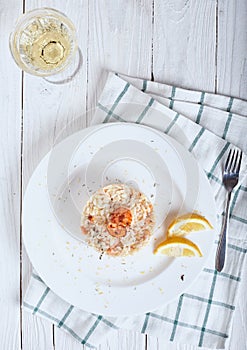 Risotto with shrimp and glass of white wine