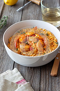 Risotto with shrimps, tomatoes and thyme. Italian food