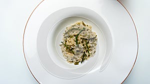 risotto with wild asparagus ,asparagus acutifolius, on italian plate