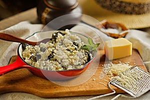 Risotto with wild mushroom served little red pan