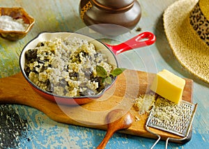 Risotto with wild mushroom served little red pan