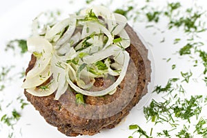 Rissole with onion rings, macro