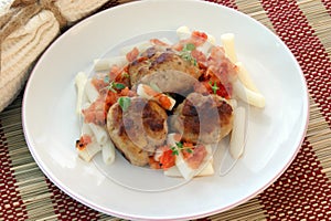 Rissole with pasta and tomato sauce