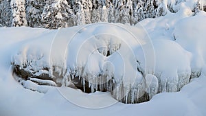 Ristafallet waterfall in winter near Are skiresort in Jamtland, Sweden