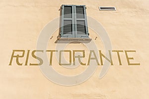 Ristorante written on rustic wall