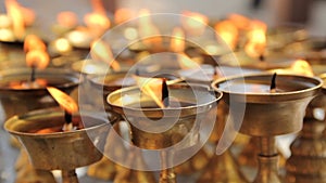 Ritual candles nearby Boudha stupa in the Nepal