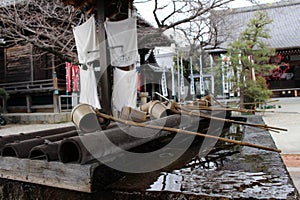 A ritual to purify the pilgrim. In Japanese, it`s called