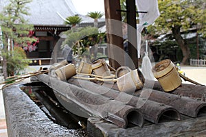 A ritual to purify the pilgrim. In Japanese, it`s called