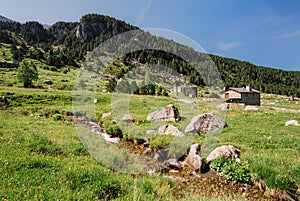 Riu de les Deveses river and mountain cabins