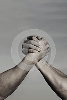 Rivalry, vs, challenge, strength comparison. Two men arm wrestling. Arms wrestling, competition. Rivalry concept - close