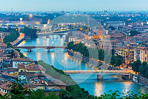 River Adige and bridges in Verona at night, Italy