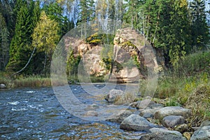 River Amta, autumn, red rocks and sunny day. Latvia. 2011