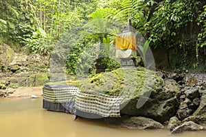 River and ancient hindu altar and Goa Giri temple in the forest
