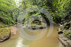 River and ancient hindu altar and Goa Giri temple in the forest