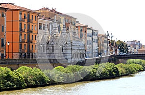 River Arno and gothic church in Pisa, Italy