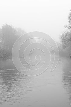 River in autumn fog