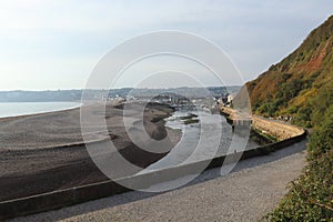 The river Axe near Seaton in Devon curves round a sandbank just before entering the sea