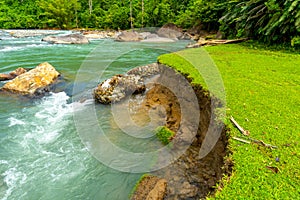 River bank erosion and damage to the gabion wall of a river