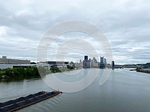 River, Barge, and City Center in Pittsburgh Pennsylvania