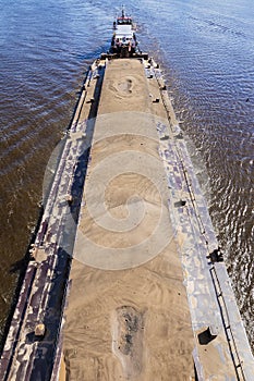 River barge loaded with sand