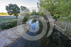 river beach of the alviela river with plenty of water.