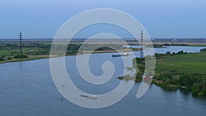 River bend, blue barge, spring day, landscape from above