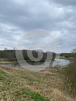 River bend. Last year\'s withered grass. Spring in the north.