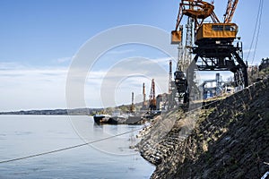 River bulk barge and cranes