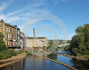 River calder in sowerby bridge with buildings reflected in the water