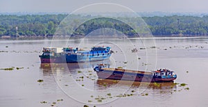 River cargo ships moored at Saigon River in Ho Chi Minh City, Vi