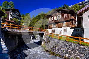 River and chalet in swiss village in Alps, Leukerbad, Leuk, Visp