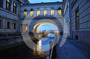 A river channel between the city\'s museum buildings at dusk.