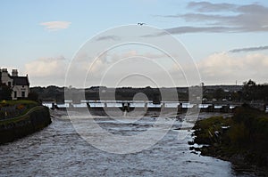 River Corrib and Dam near a Cathedral in Galway, Ireland