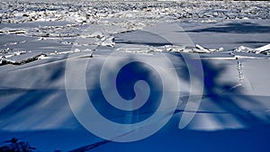 River covered with piles of ice smithereens photo