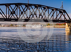 River cruise boat docked in Dubuque IA under Railroad bridge