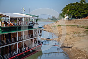 River cruiser on the banks of the Irrawaddy River, Myanmar.
