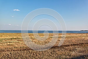 River dividing field and sky