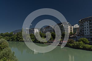 River Drau in Villach town in south Austria in hot summer sunny morning