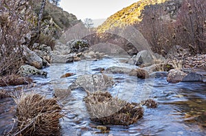 River Estena flowing in winter. National Park of Cabaneros, Spain photo