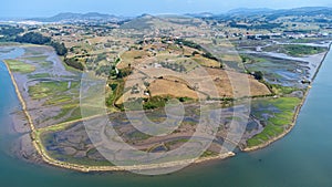 River, estuary, and rural landscape. Aerial view. Besaya, Cantabria, Spain