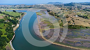 River, estuary, and rural landscape. Aerial view. Besaya, Cantabria, Spain photo