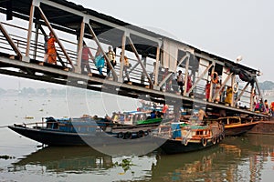 River ferry passengers go ashore at the dock