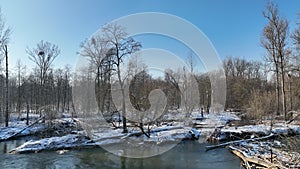 River floodplain delta winter snow meander drone aerial inland video shot in sandy sand alluvium freezing cold frost