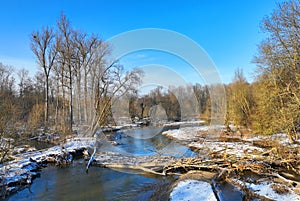 River floodplain delta winter snow meander drone aerial inland video shot in sandy sand alluvium freezing cold frost, benches