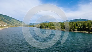 river flow among green mountain