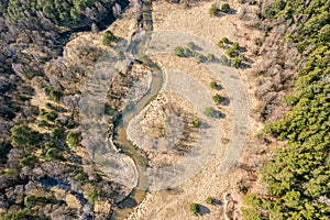 River flow through the valley. spring landscape at sunny day. aerial view